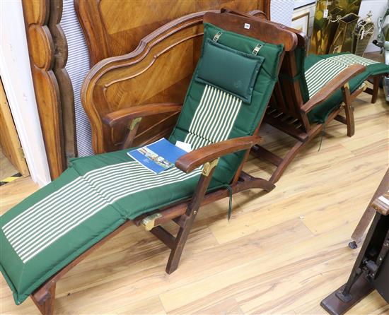 A pair of Steamer lounger chairs